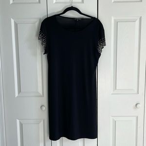 Black A-line dress with embellished short sleeves